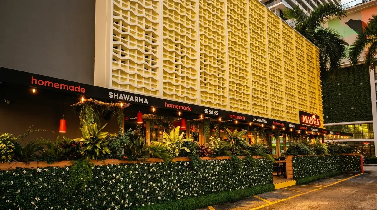 The Mangal Edgewater storefront on Biscayne Boulevard, with the outdoor seating out front