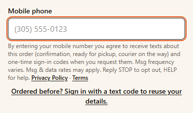 The checkout phone field with the text-message disclosure under it, as shown on a phone